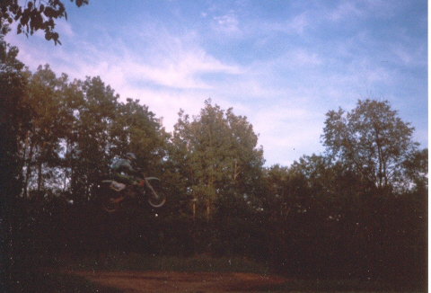 A woman mountain biking; Actual size=180 pixels wide